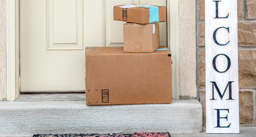 Packages on the doorstep of a home with a welcome sign in Lakeland